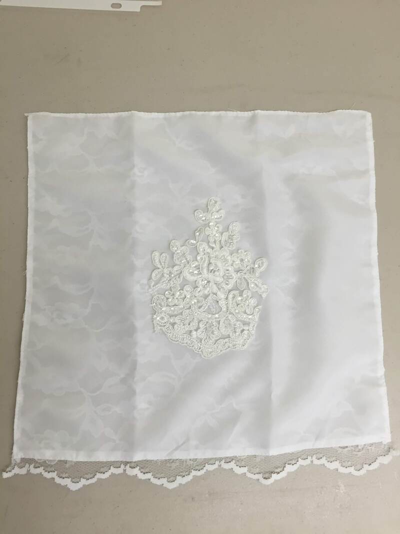 handkerchief had dress applique and detail added to it as a keepsake for her mother to remember her wedding day